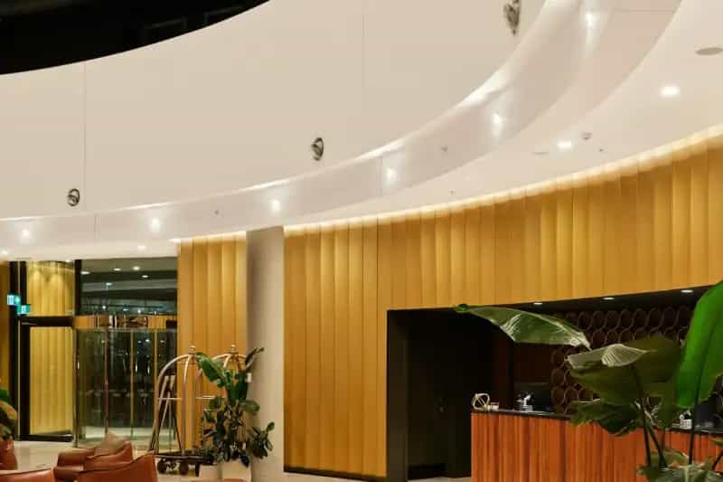 Modern hotel lobby with reception desk and comfortable seating area